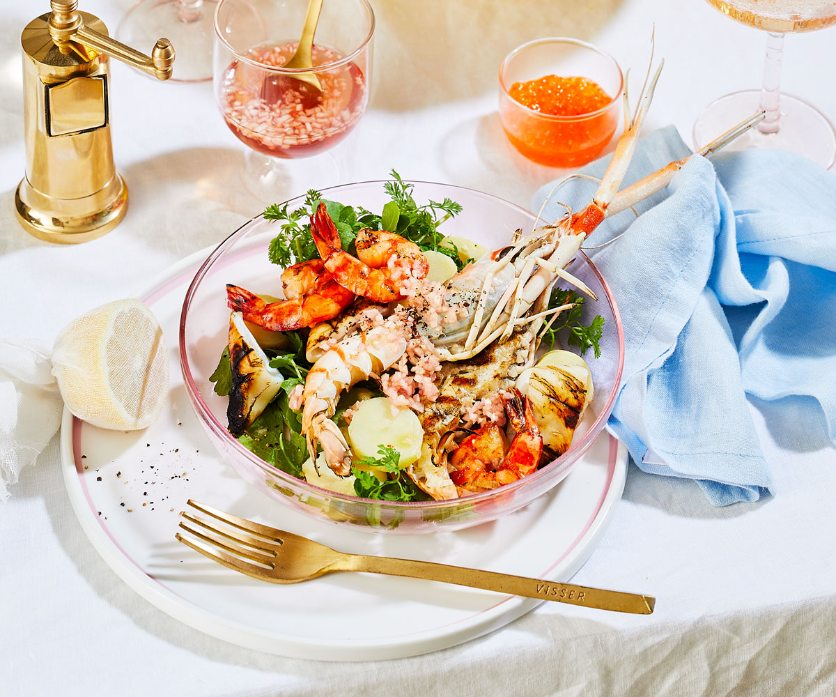 bowls-of-mixed-seafood-salad-and-bread-sticks